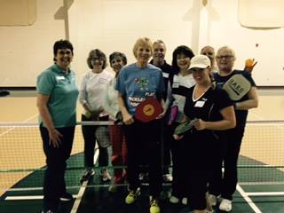 Judy Bowman, center, and pickleball aficionados at the YMCA in VA