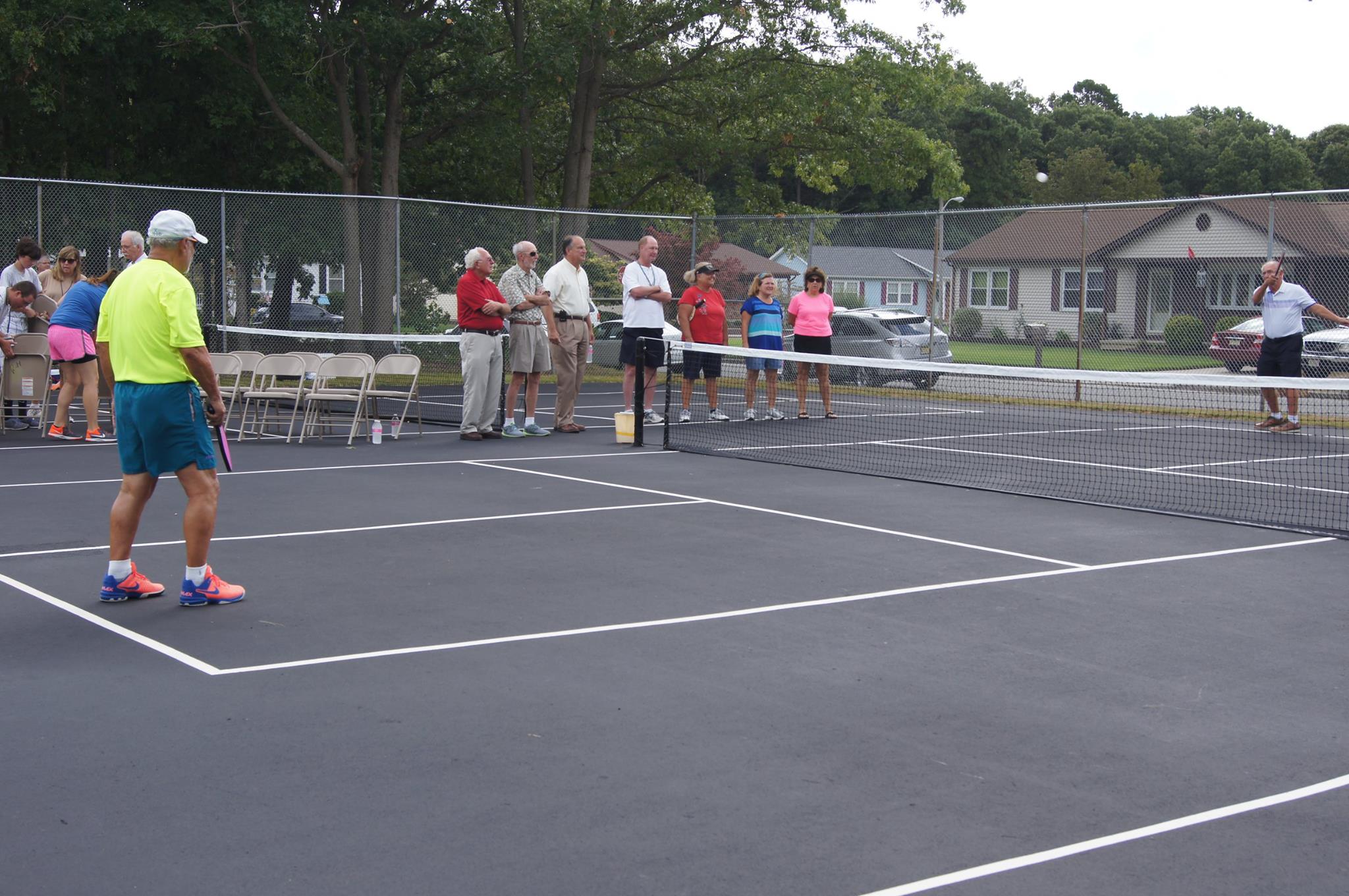 Mayor McCullough serving the first ball — at Delilah Oaks Pickleball Courts