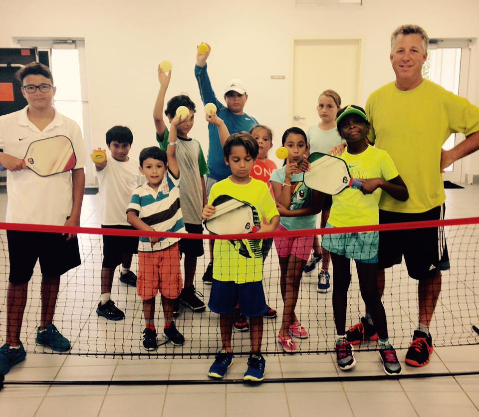 Steve Kennedy with some of his tennis summer camp kids hitting pickleballs — with George English Tennis Camp, Engage pickleball and Steve Kennedy Pickleball.