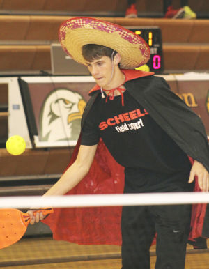 Playing pickleball in sombrero and cape - little Lucha Libre influence? 