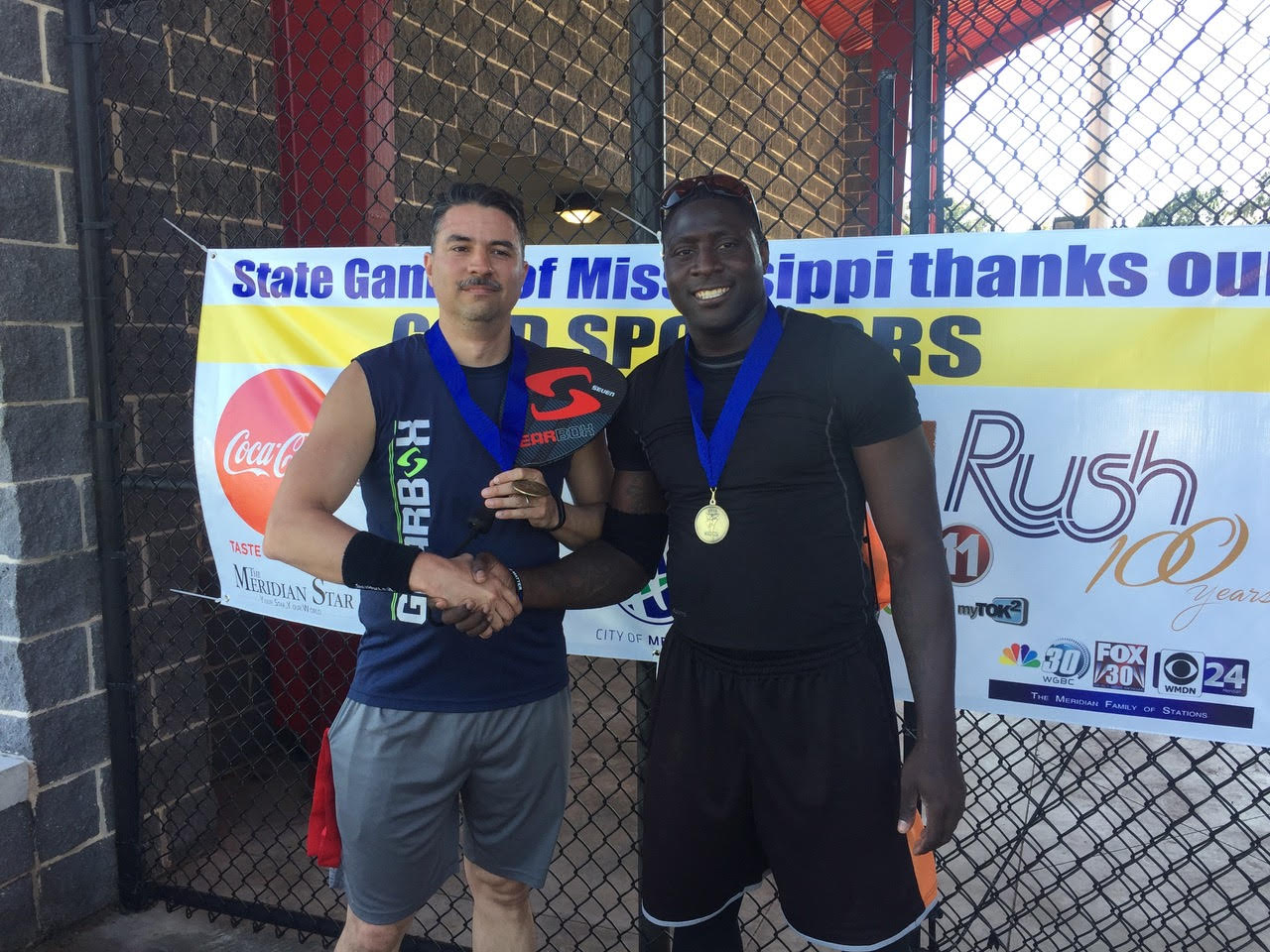 Officers Brian Acuna (L) and Deputy Tyrus Mack (R) sporting gold medals