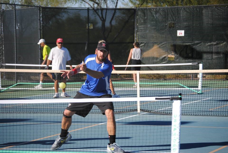 Wes Gabrielsen at the net involved in a pickleball game